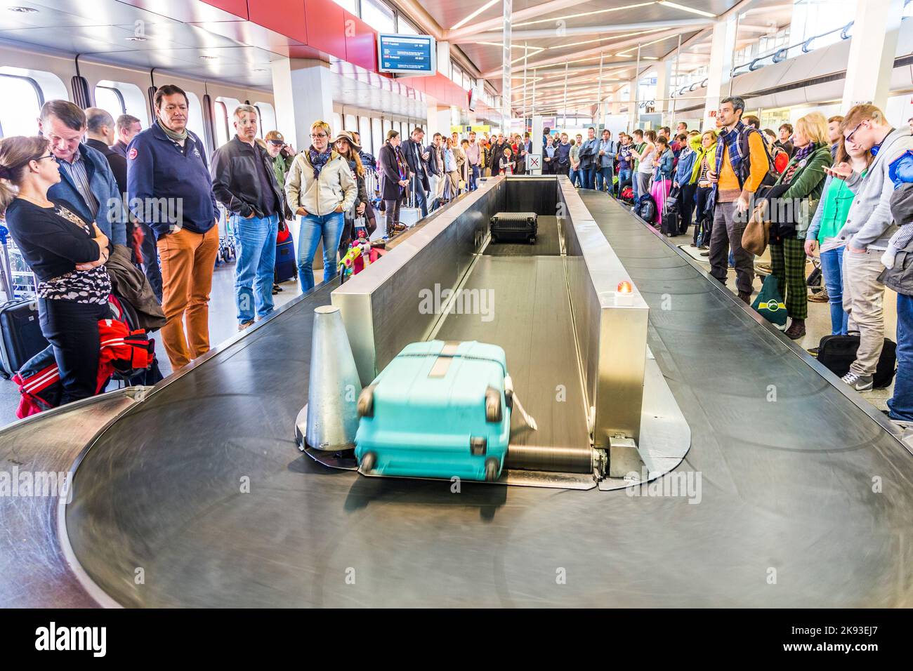 BERLIN, GERMANY OCT 27, 2014 people wait at baggage belt in Tegel