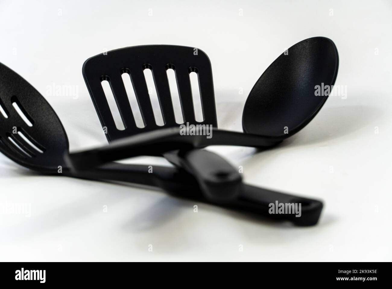 black plastic kitchen utensils isolated on white. Clipping path