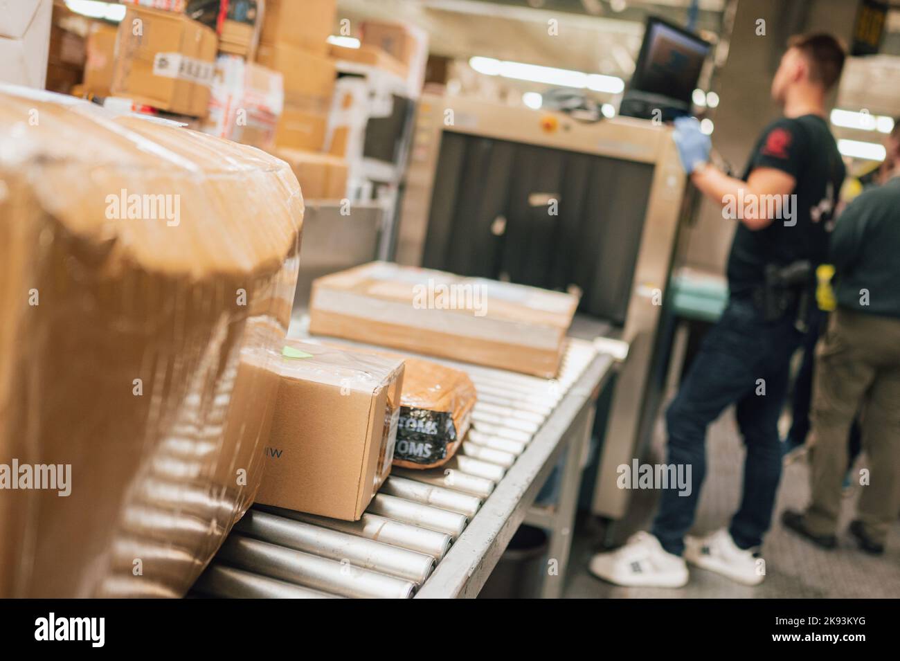 Cologne, Germany. 21st Oct, 2022. Packages lie on a conveyor belt to be