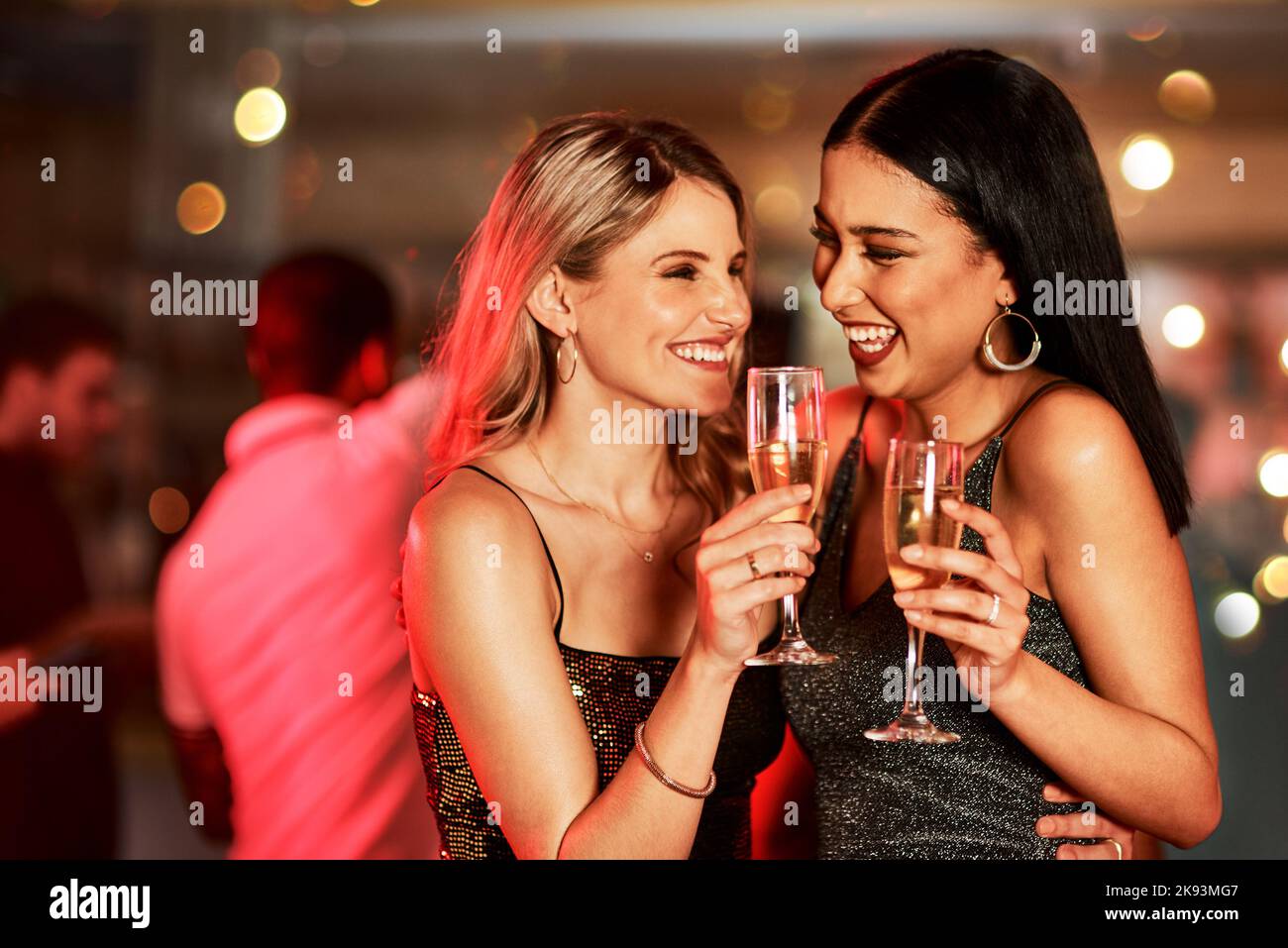 Should we have another drink. two cheerful young women having a