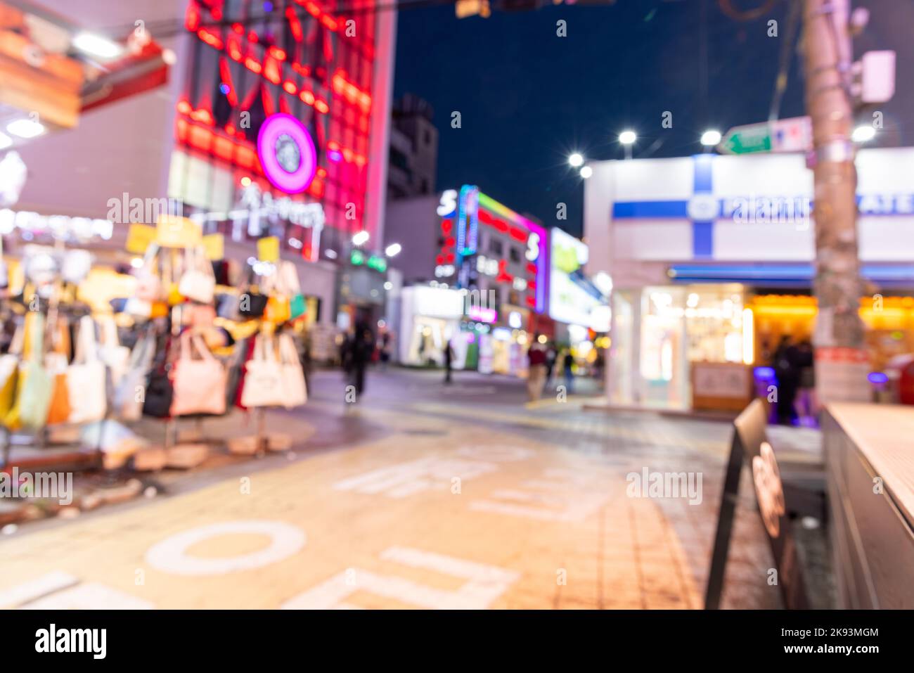 Blurred view of Seoul street with modern buildings, pavements and stylish people walking. Can be used as background. De focused image of capital of so Stock Photo