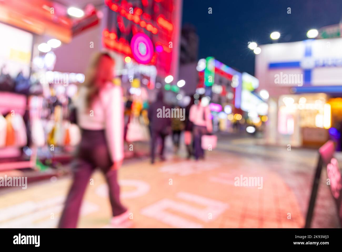 Blurred view of Seoul street with modern buildings, pavements and stylish people walking. Can be used as background. De focused image of capital of so Stock Photo