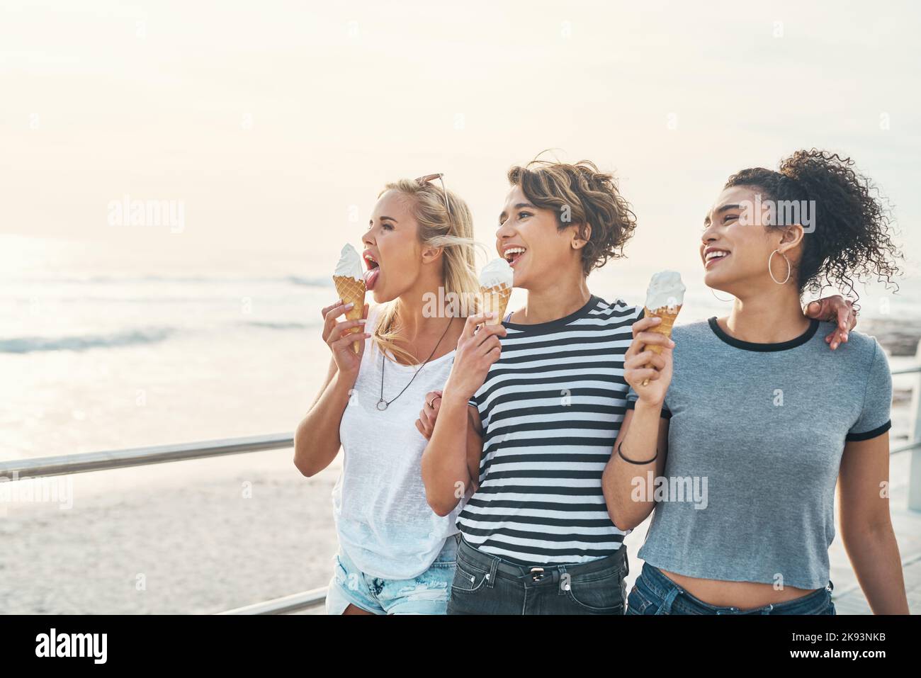 You cant buy happiness but you can buy ice cream. three friends eating