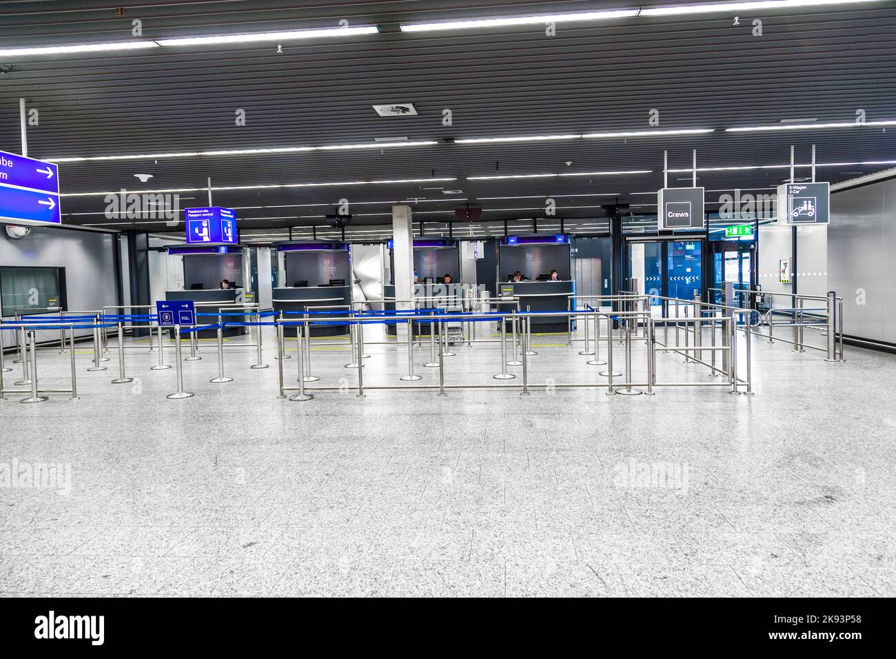 FRANKFURT, GERMANY - JUNE 8: The early shift of border control police waits for passengers in Terminal 1 at Frankfurt Rhein Main airport Gate C to che Stock Photo