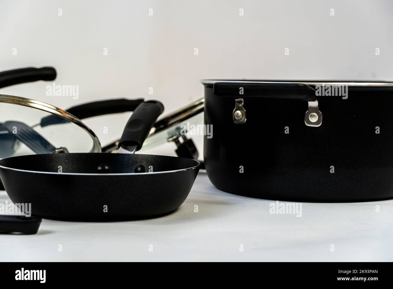 cookware set, steel dinner set isolated on white background, black