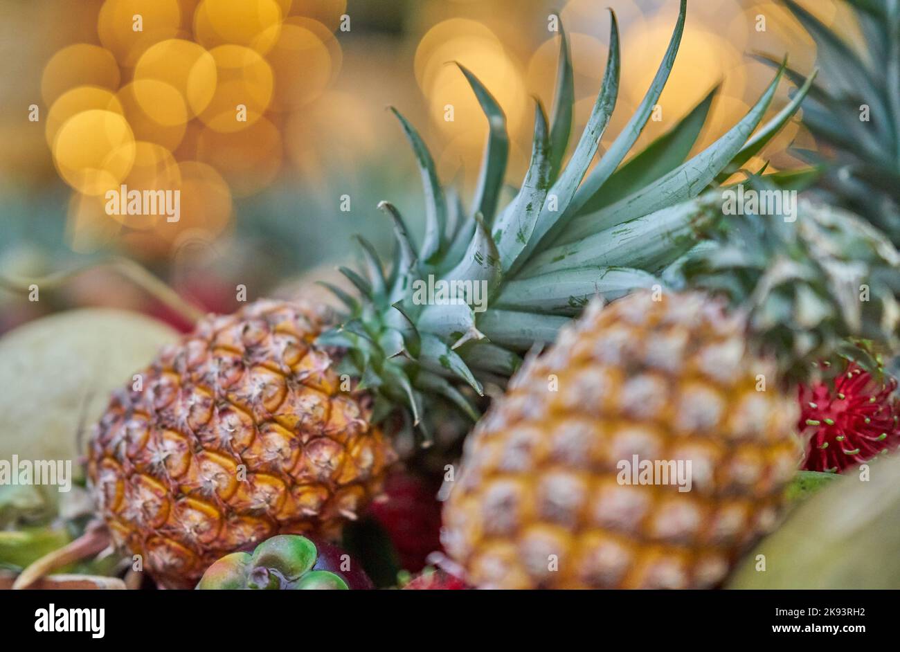 Fresh pineapple display at a local fruit market, Thailand. Stock Photo