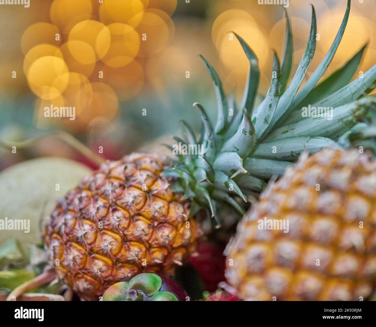 Fresh pineapple display at a local fruit market, Thailand. Stock Photo