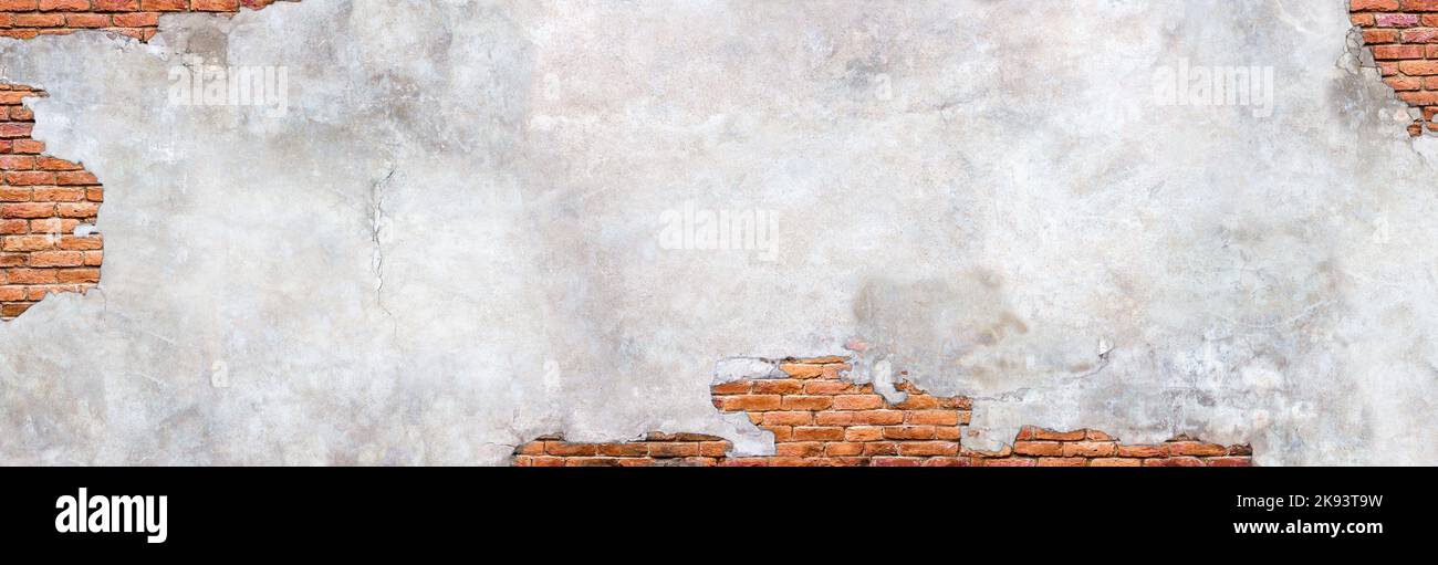 Damaged plaster wall background. Antique brick wall under concrete texture. Stock Photo