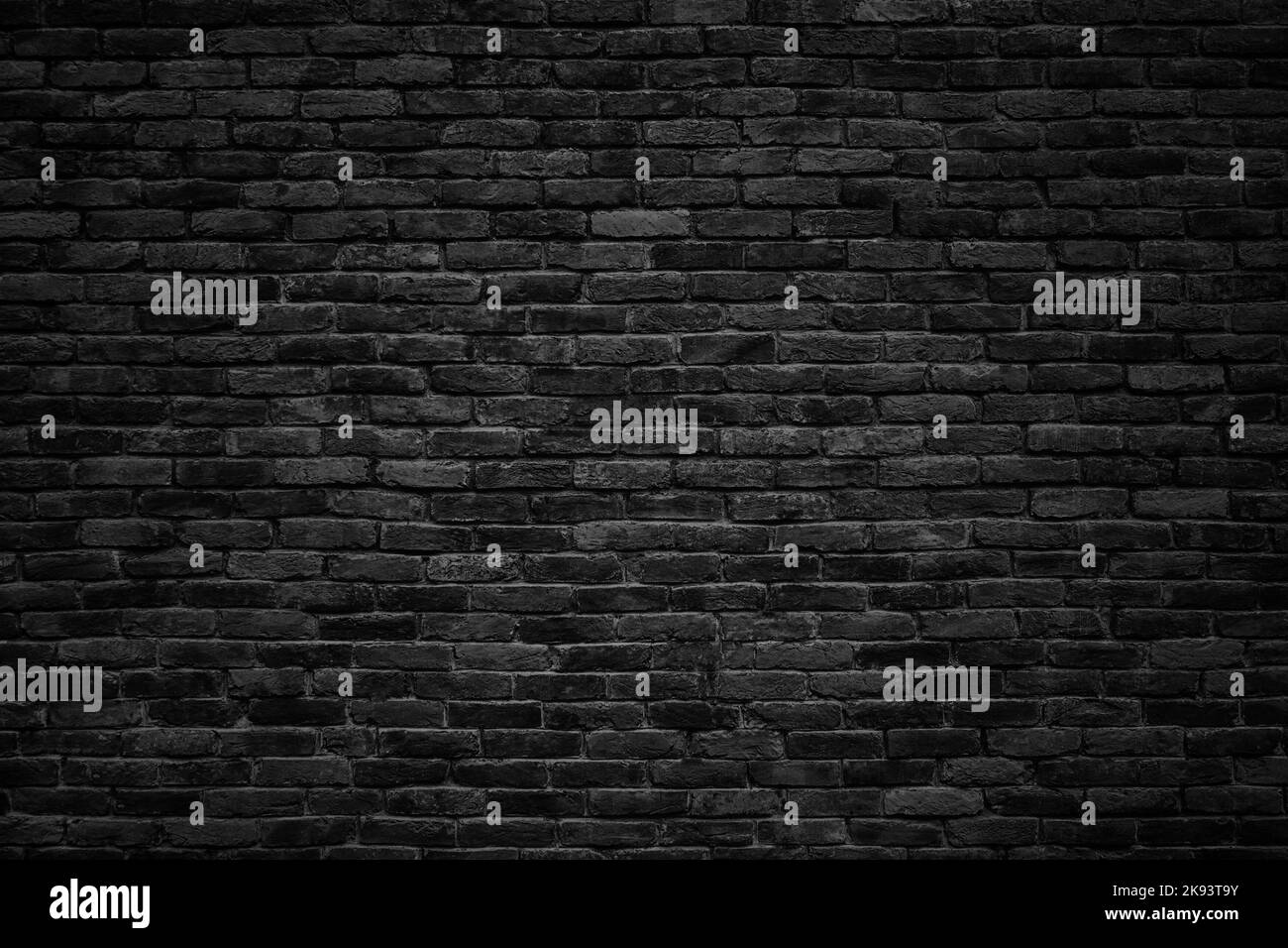 gloomy background, black brick wall of dark stone texture Stock Photo