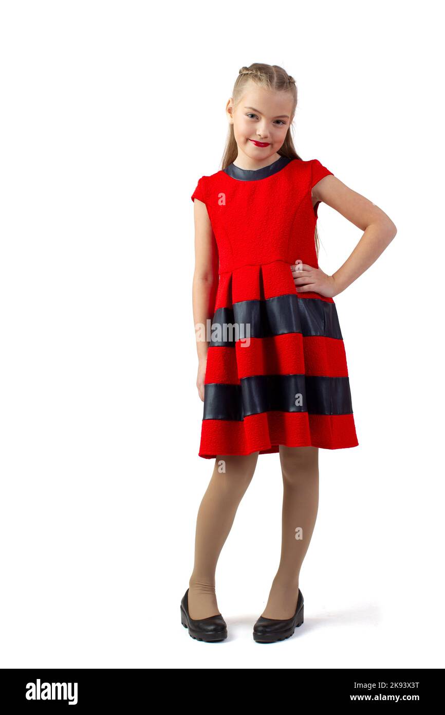 Funny teen girl in a red dress on a white background. Little ...
