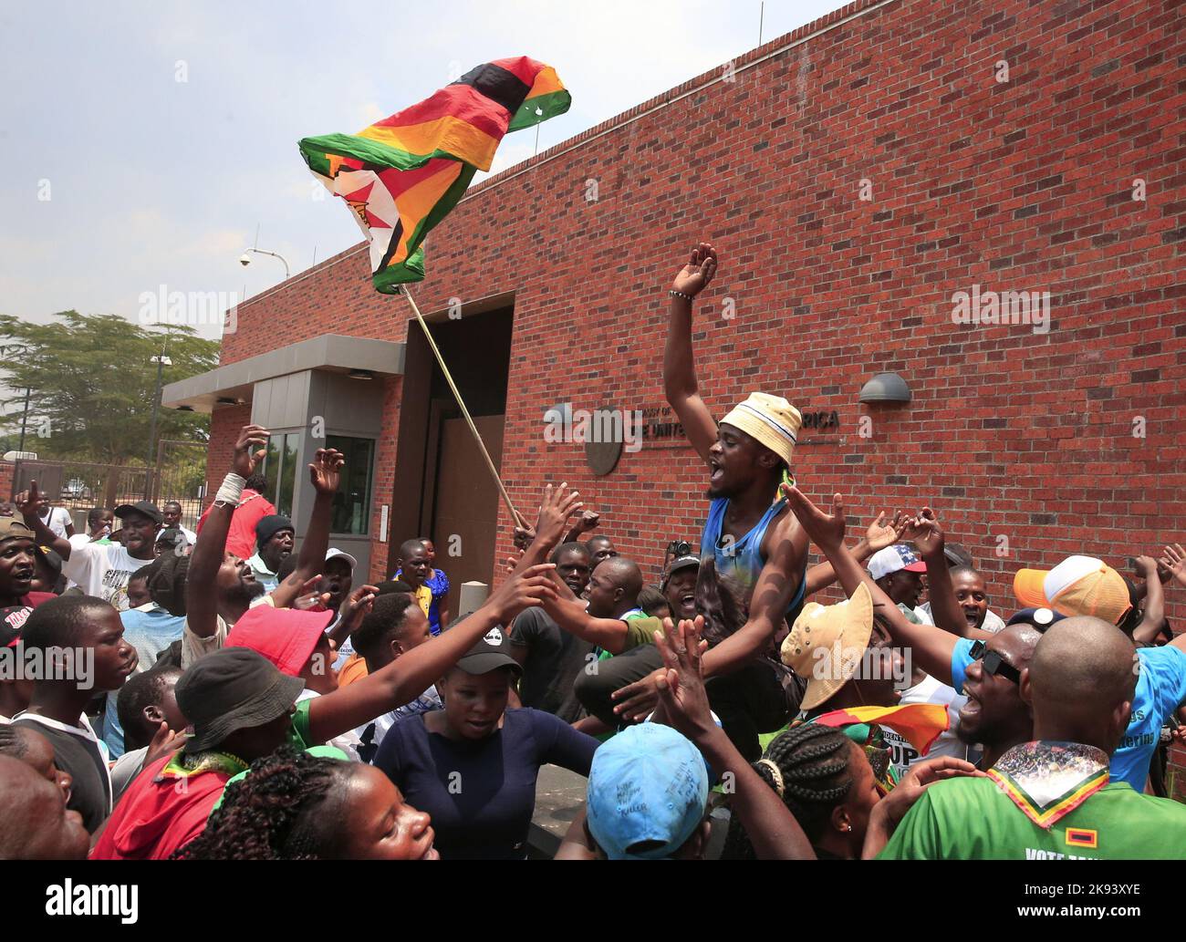 Harare, Zimbabwe. 25th Oct, 2022. People gather outside the United