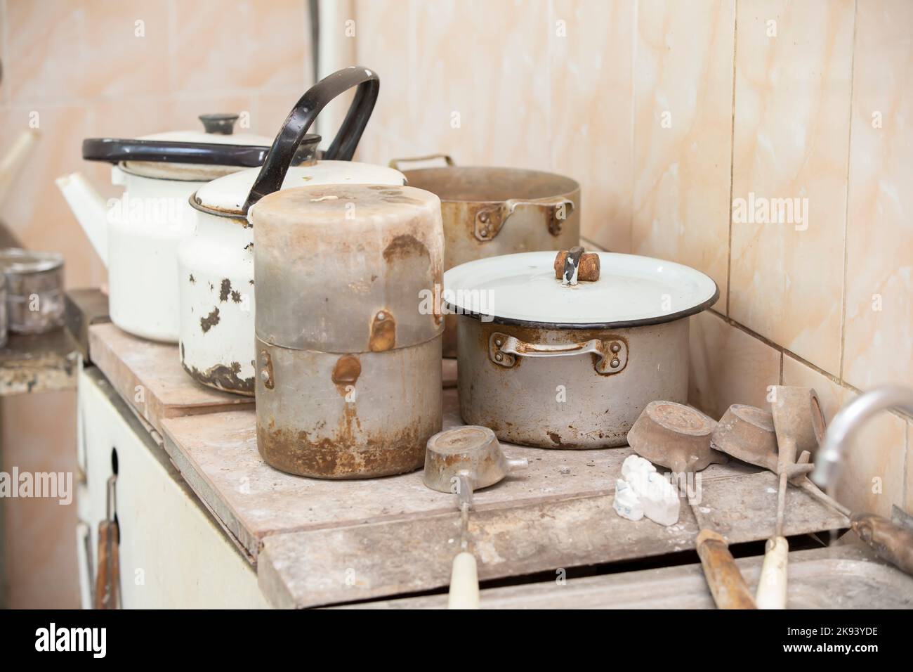 Old dirty rusty crockery pots and kettles Stock Photo Alamy