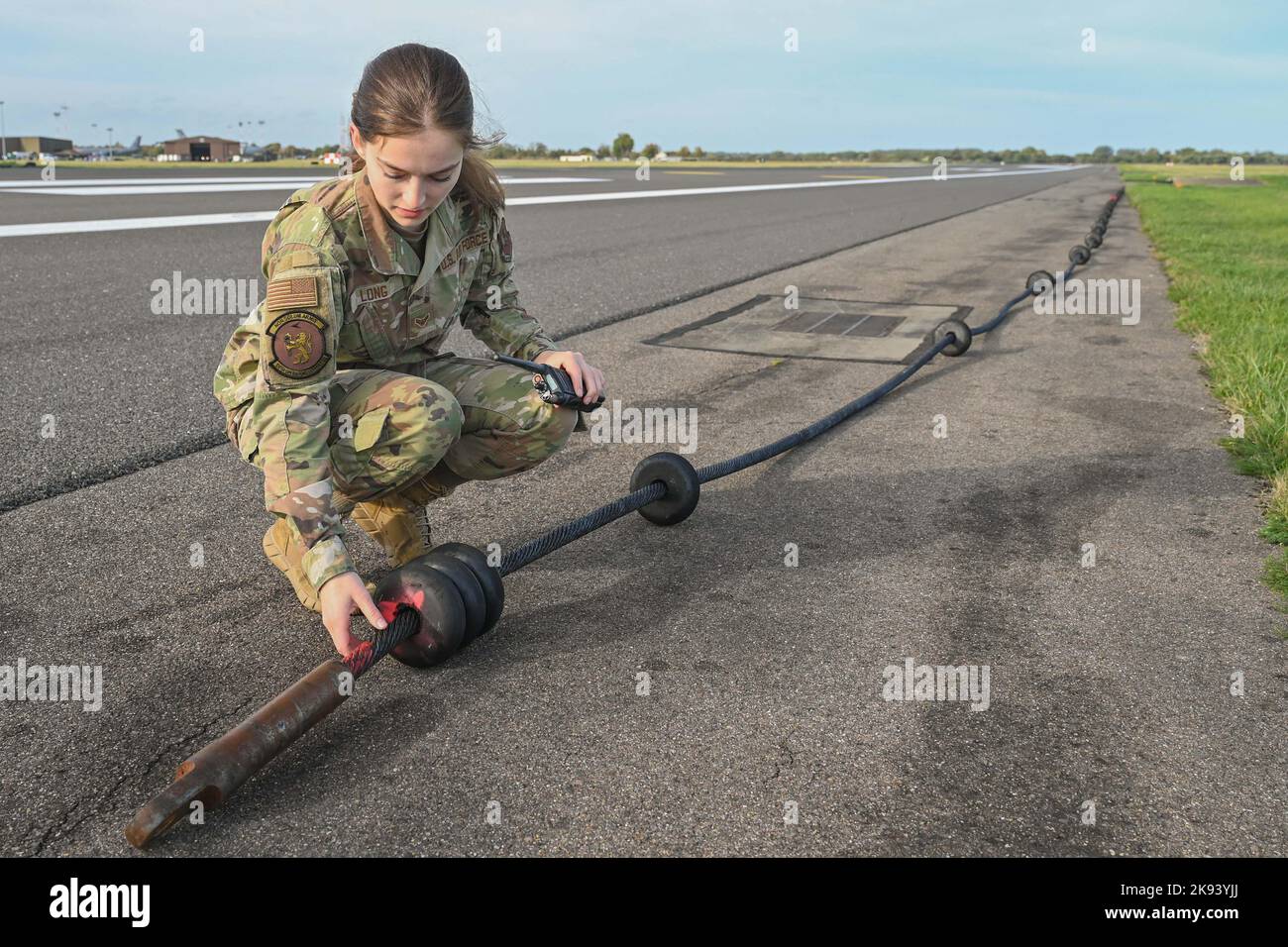 RAF Mildenhall, UK. 19th Oct, 2022. U.S. Air Force Airman 1st Class Elizabeth Long, 100th Operations Support Squadron airfield management shift lead, inspects arresting gear on the flightline at Royal Air Force Mildenhall, England, Oct. 19, 2022. Long inspects the cabin for quality assurance to make sure that is not deteriorating. Credit: U.S. Air Force/ZUMA Press Wire Service/ZUMAPRESS.com/Alamy Live News Stock Photo