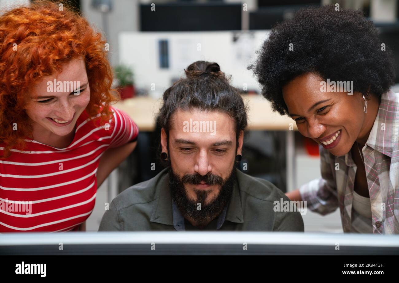 Diverse group of professionals meeting in office. IT programmers use ...