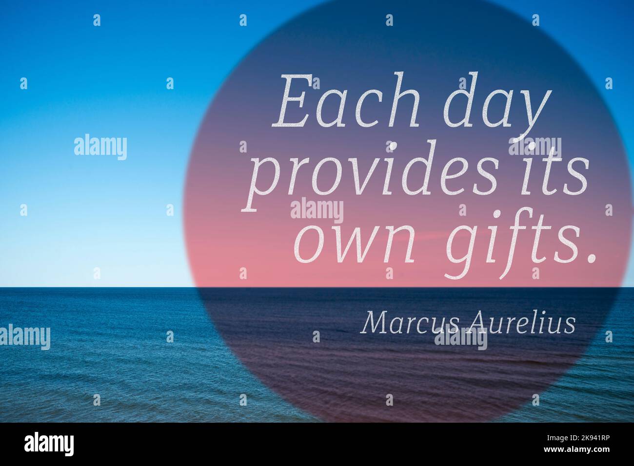 Each day provides its own gifts - quote of ancient Roman emperor and philosopher Marcus Aurelius printed over photo with calm sea landscape Stock Photo