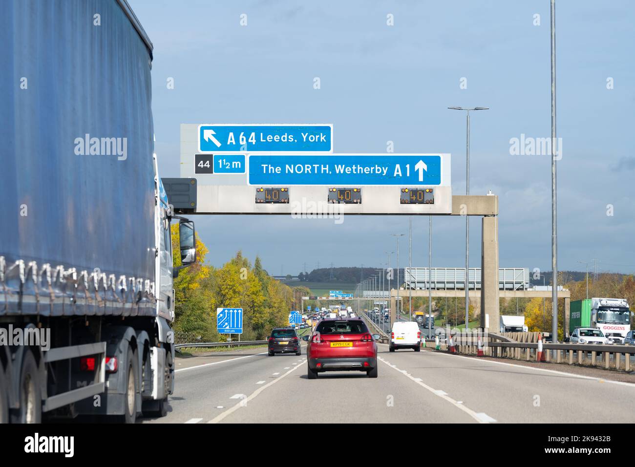 A1 motorway traffic northbound junction 44 A64 Leeds, York, A1 The NORTH, Wetherby sign, England, UK Stock Photo