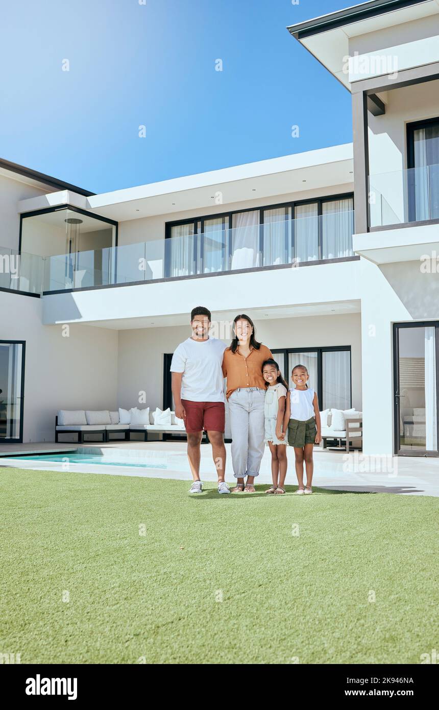 Portrait, real estate and happy family moving into their new luxury