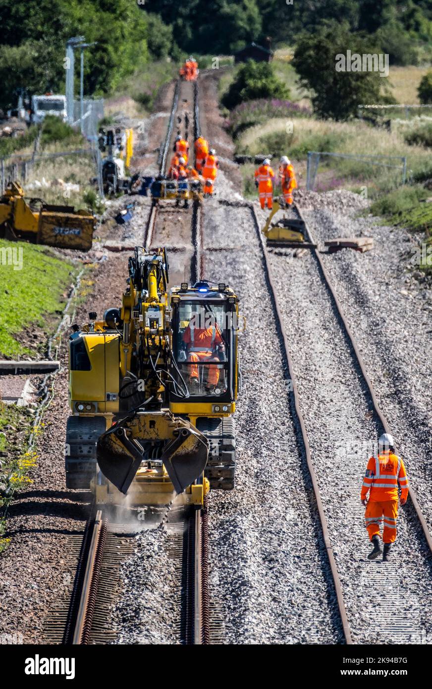 Railway workers building new railway and knocking down bridges Stock Photo