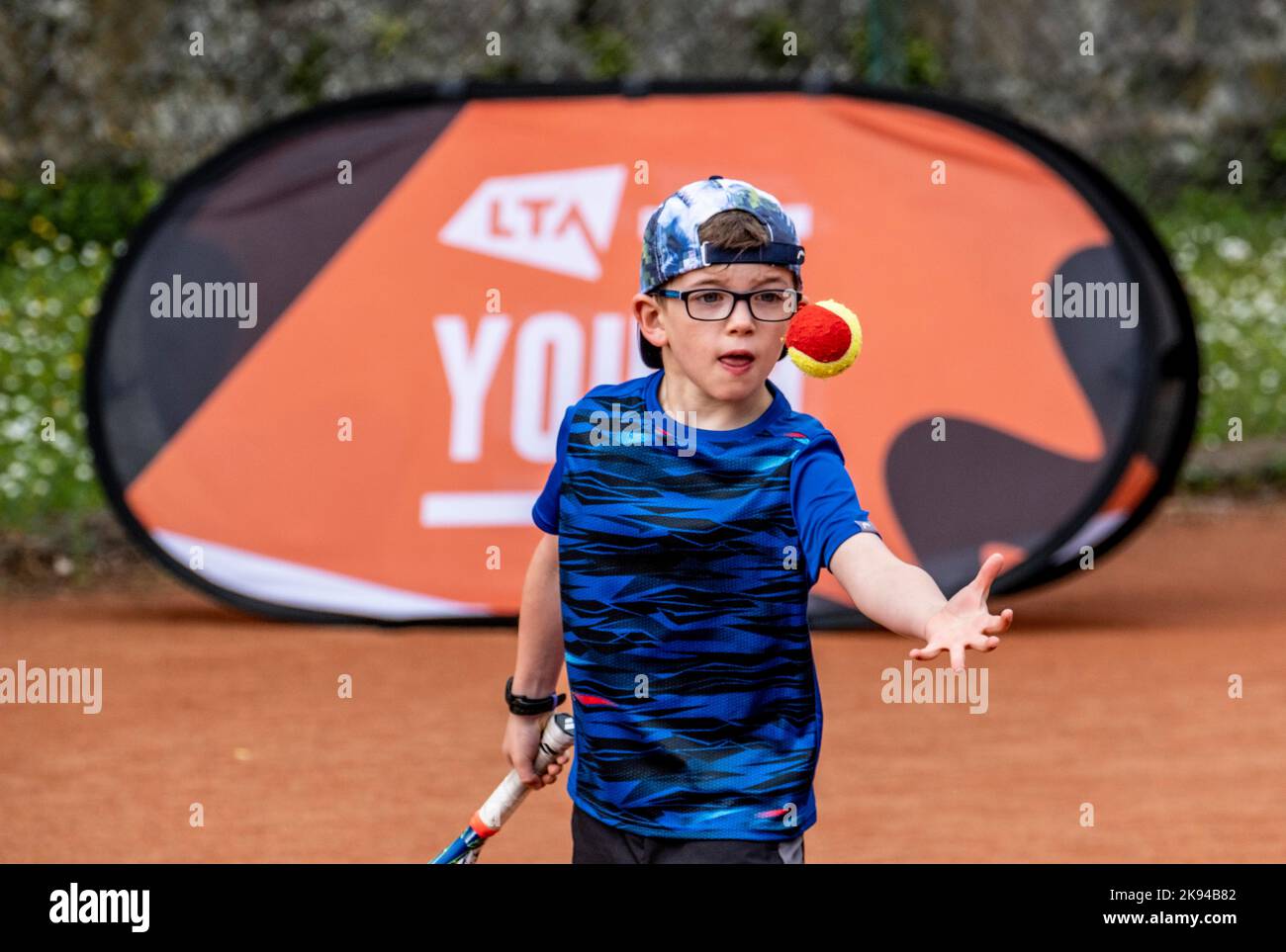 Children playing tennis and having tennis lessons Stock Photo Alamy
