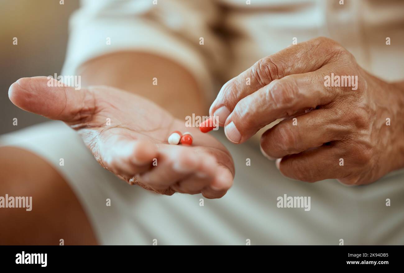 Healthcare, pills and hands of elderly person with capsules, medication and treatment in palm. Health, wellness and senior citizen with medicine for Stock Photo