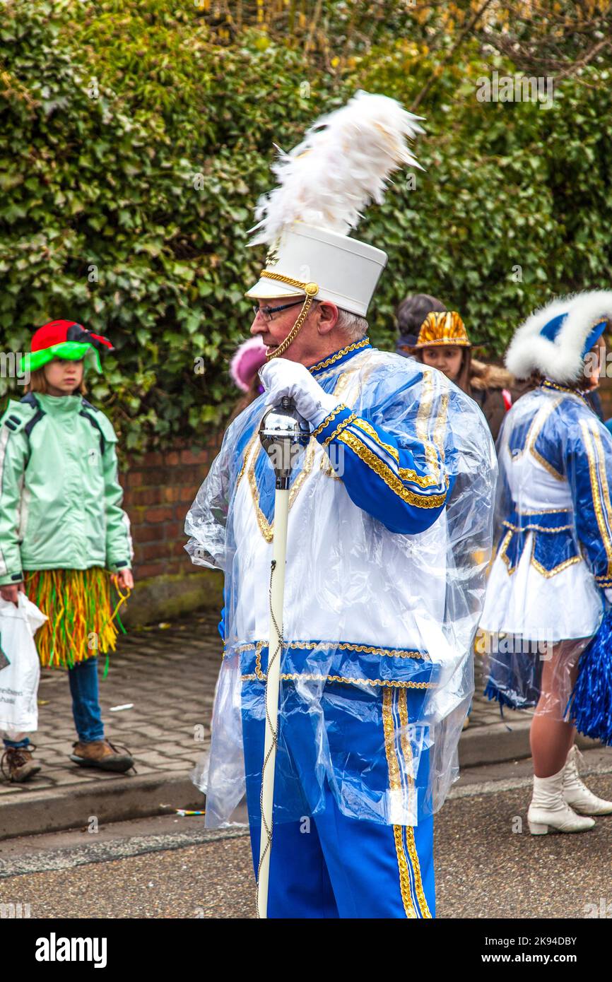 SCHWALBACH, GERMANY - FEBRUARY 27: The carnival  brass band  moves through the city on February 27, 2011 in Schwalbach, Germany. The Brass Band Rheinm Stock Photo