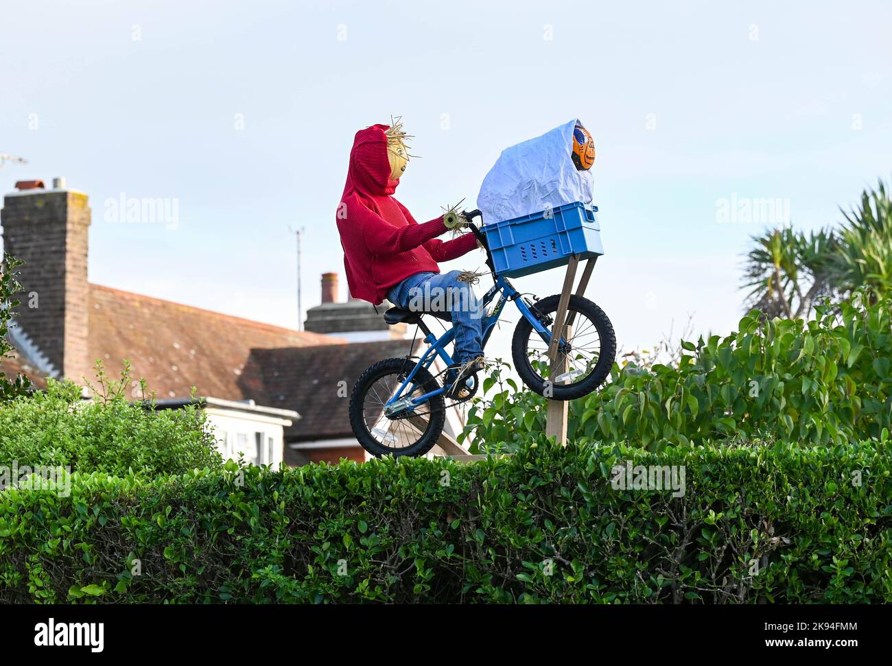 Worthing UK 26th October 2022 - ET has appeared flying over a hedge in the annual Scarecrow Festival in Ferring village near Worthing , West Sussex . Over 70 scarecrows are expected to appear throughout the village over the week : Credit Simon Dack / Alamy Live News Stock Photo