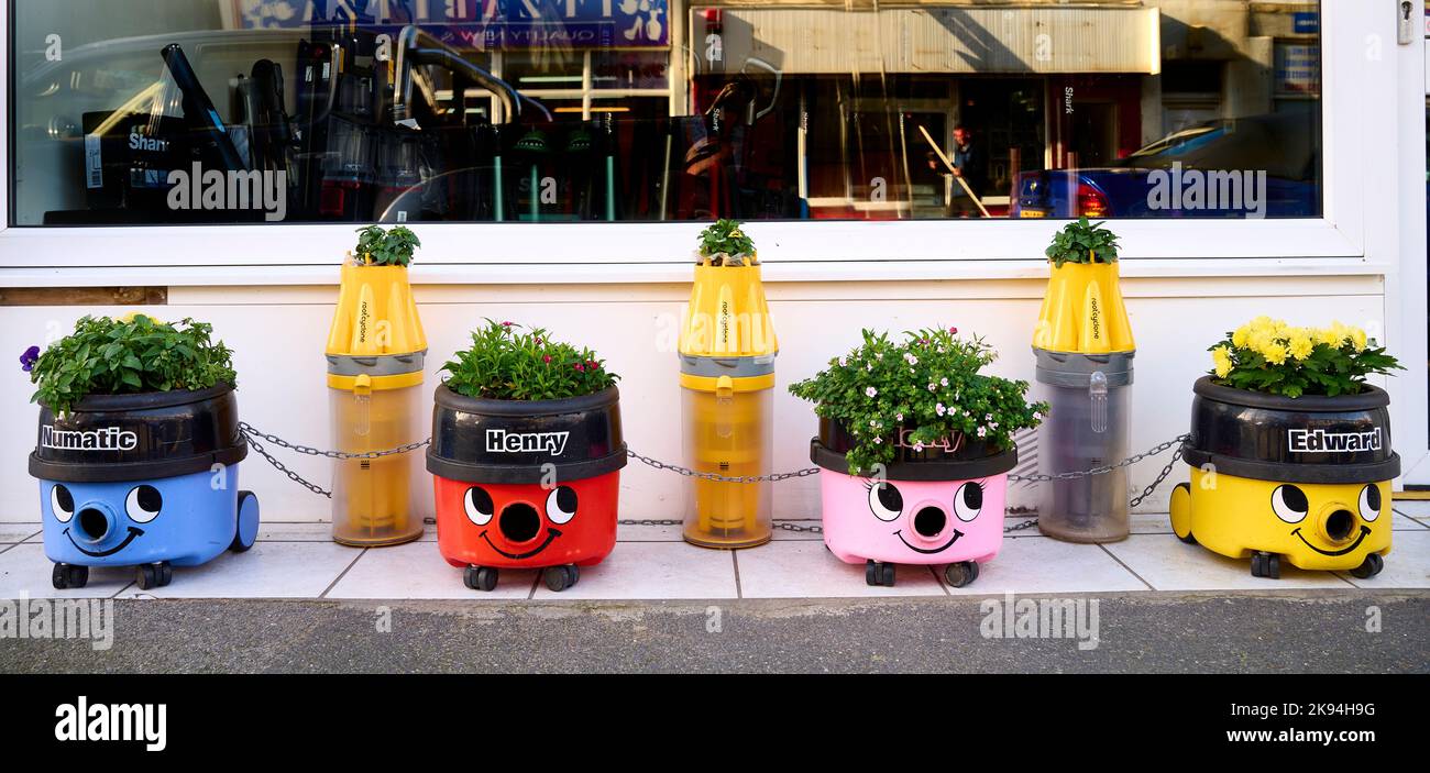 Henry vacuum cleaners flower pots outside vacuum cleaner repair shop Stock Photo