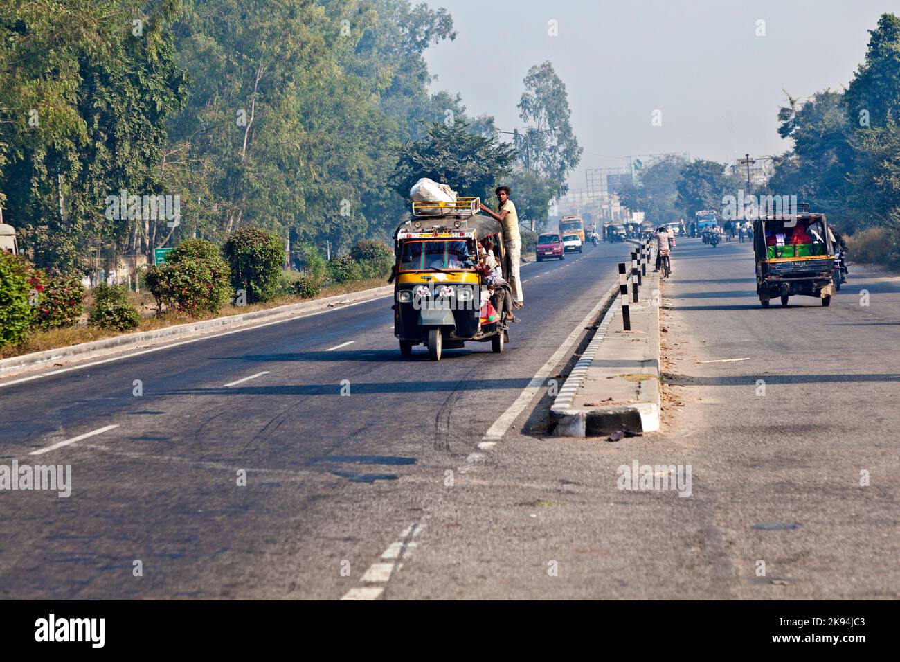 AGRA, INDIA - NOV 16: people in overloaded rickshaws on the Highway on ...