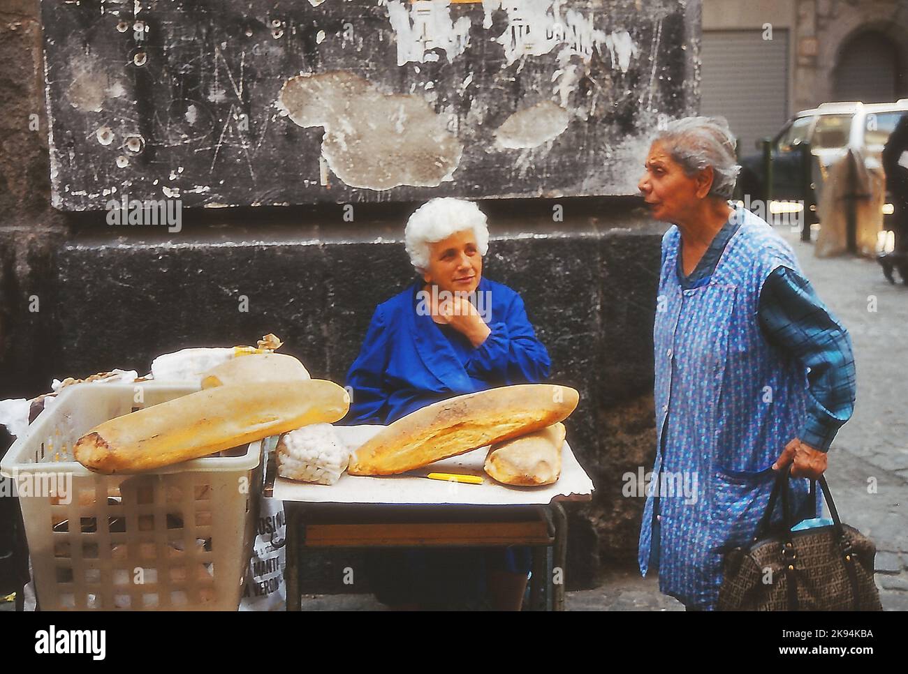 Napes 1985, historical center, elderly woman illegal bread seller. Stock Photo