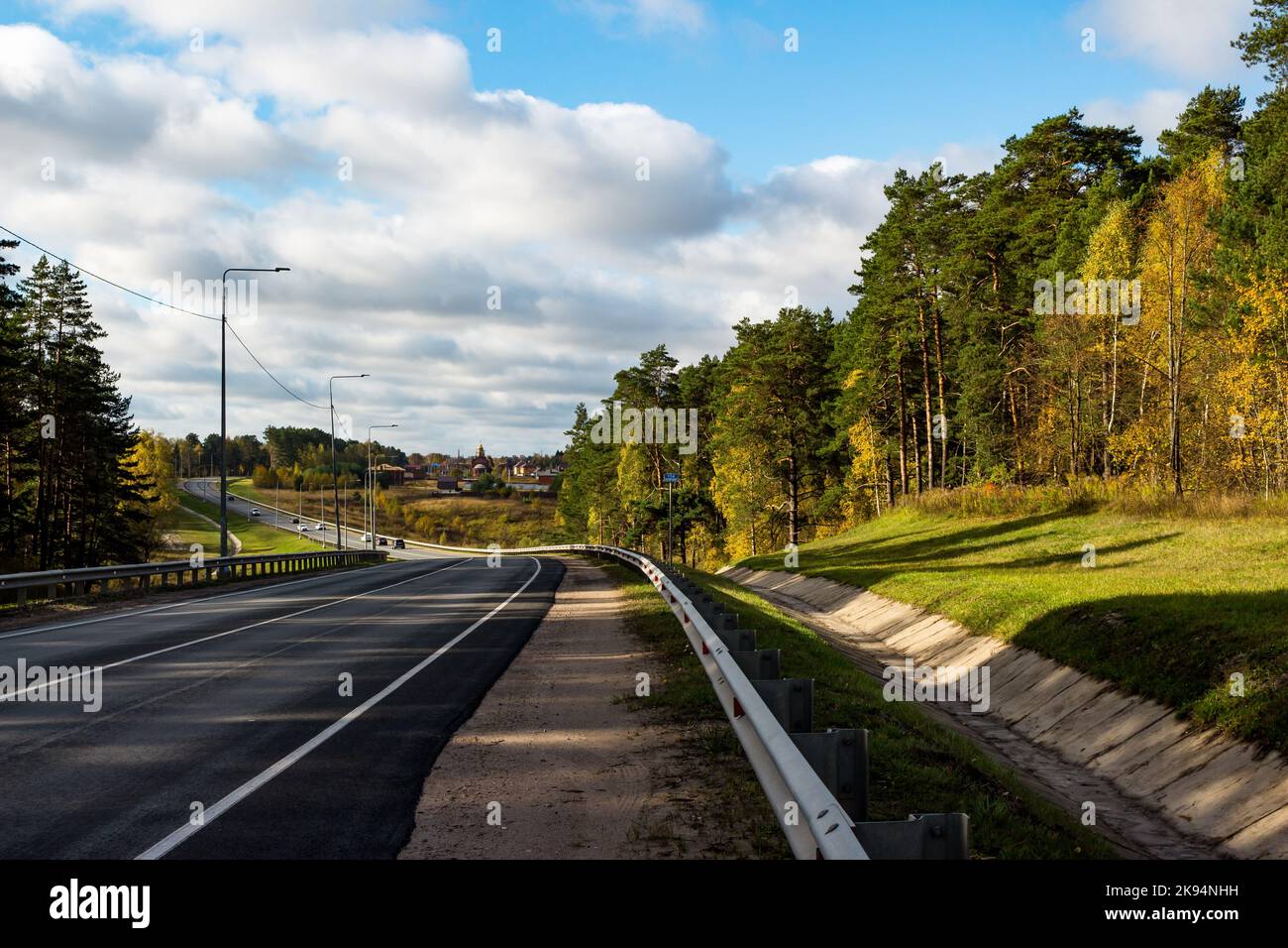 A beautiful view of the turn of the highway in a picturesque area. Varshavskoye highway A130 towards the city of Maloyaroslavets, Kaluga region, Russi Stock Photo