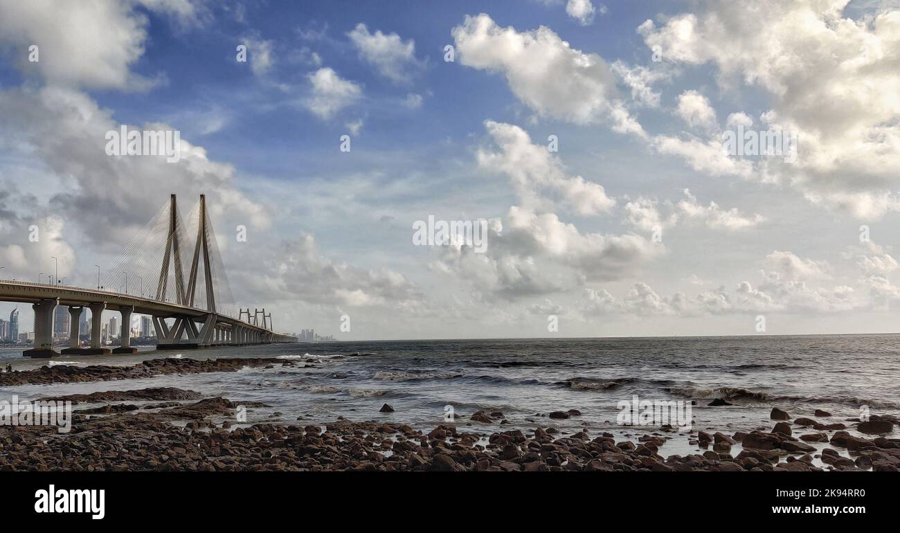 Bottom view to Bandra Worli Sea Link bridge through the rocky beach ...