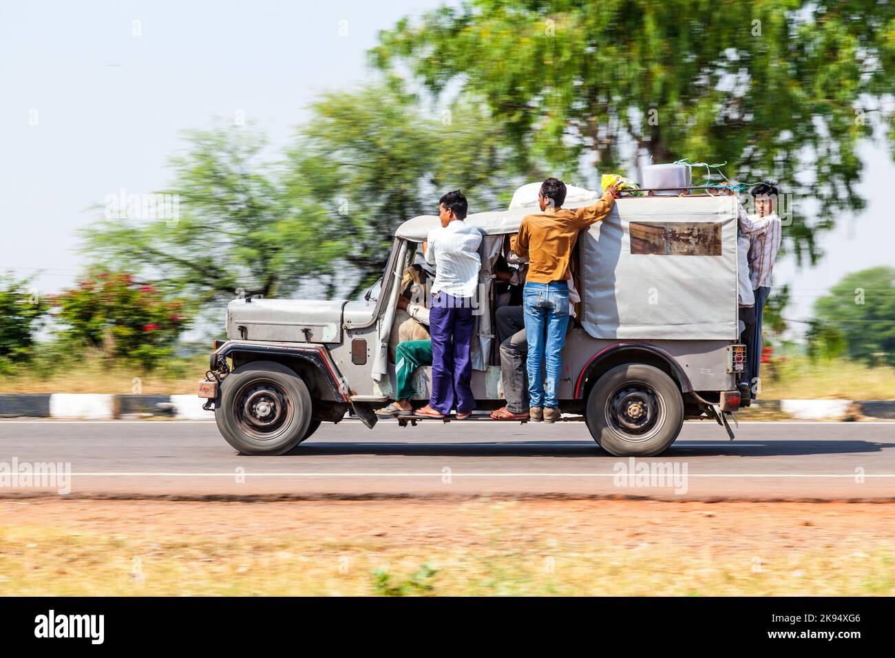 RAJASTHAN - INDIA - OCTOBER 18: Many people in an old indian car on highway on October 18, 2012 in Rajasthan, India. Overloading is the most big probl Stock Photo