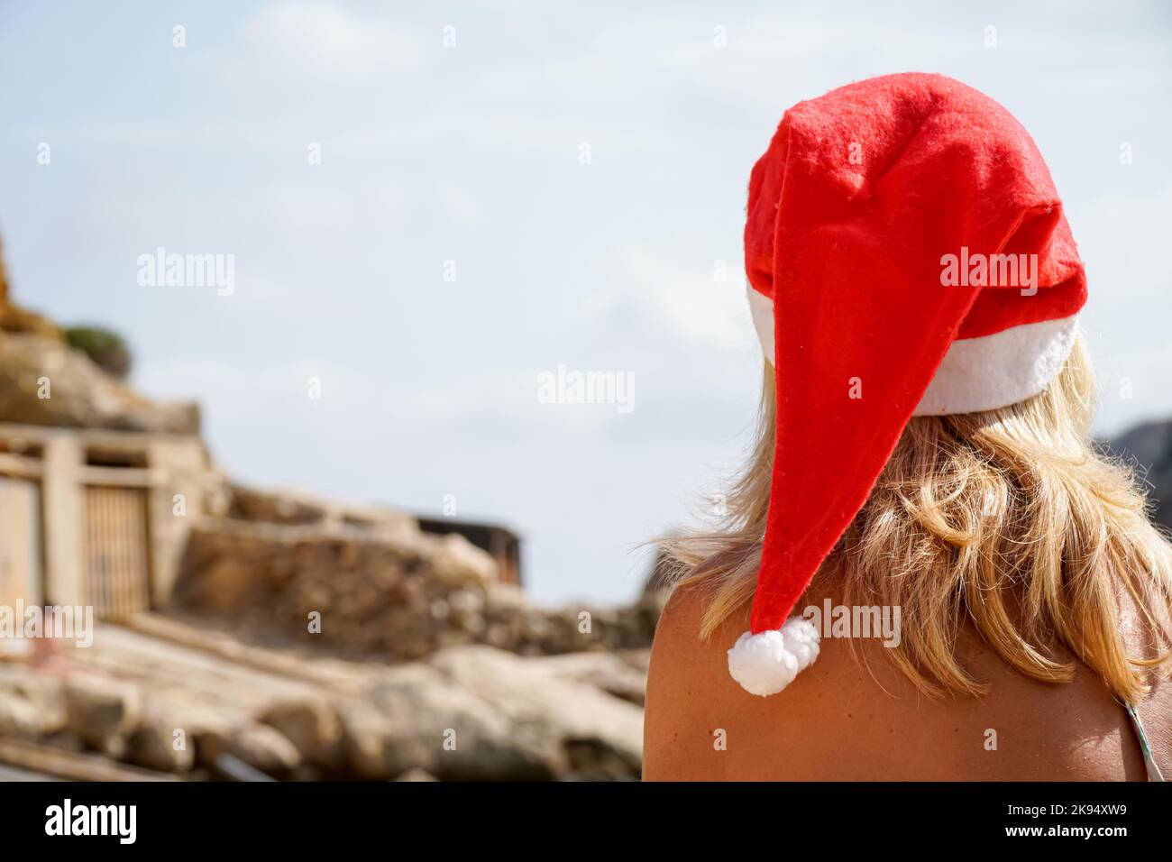 Woman santa hat rear view hi-res stock photography and images - Alamy