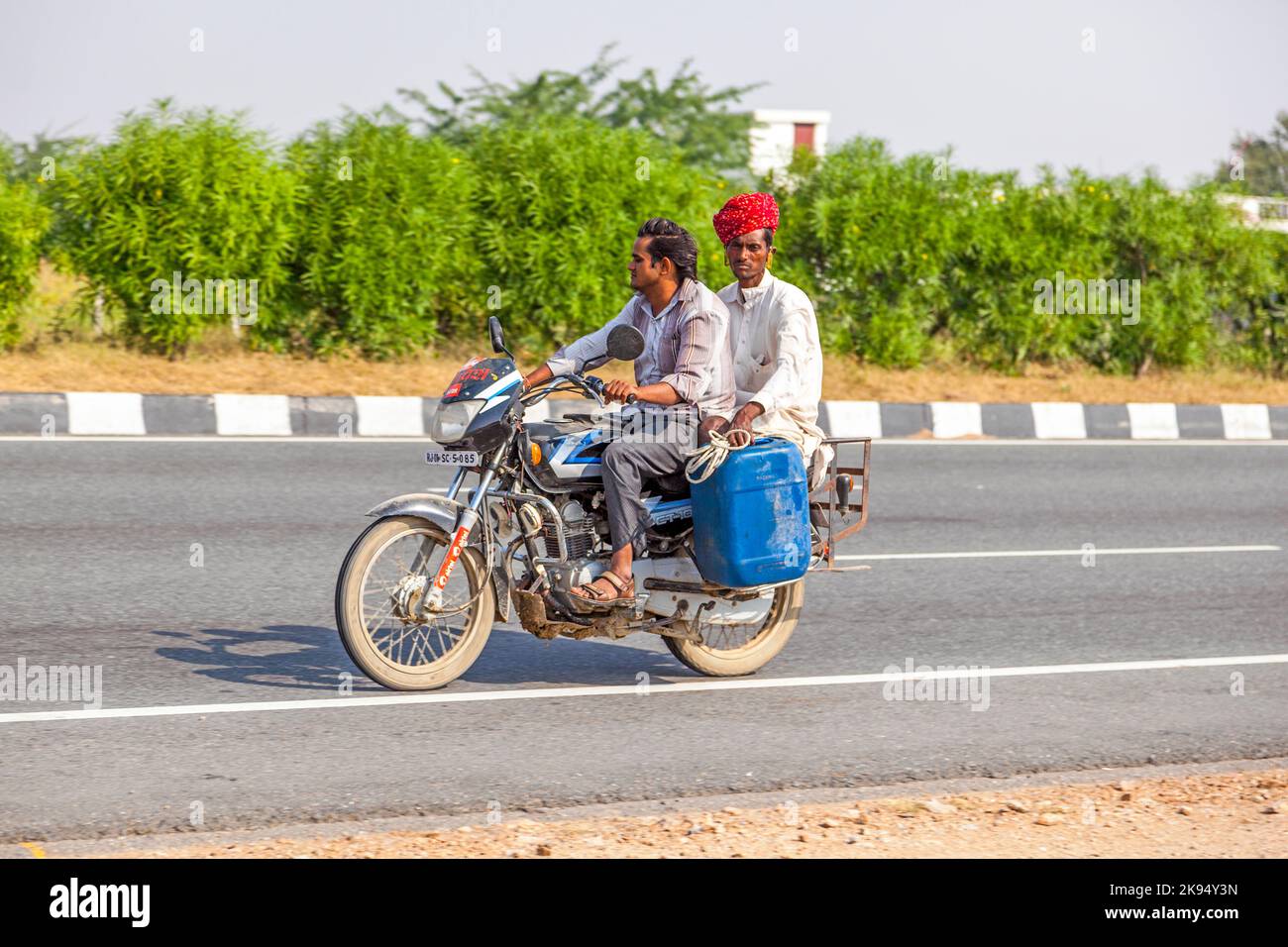 RAJASTHAN - INDIA - OCTOBER 18: family ride scooter on highway on October 28, 2012 in Rajasthan, India. Up to six family members manage to ride these Stock Photo
