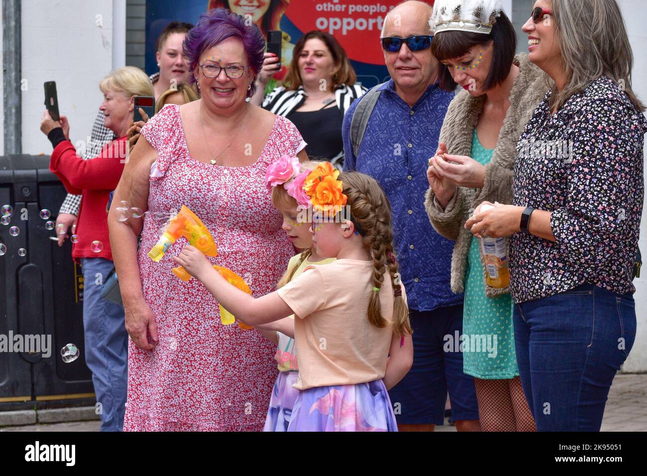 People watching the the vibrant colourful Cornwall Prides Pride parade