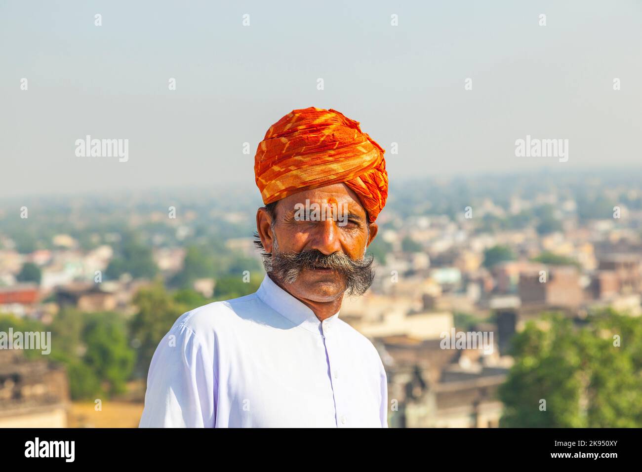 MANDAWA, INDIA - OCT 25: A Rajasthani man wearing traditional colorful turban and loves to pose in the palace for tourists on OCT 25, 2012 in Pushkar, Stock Photo