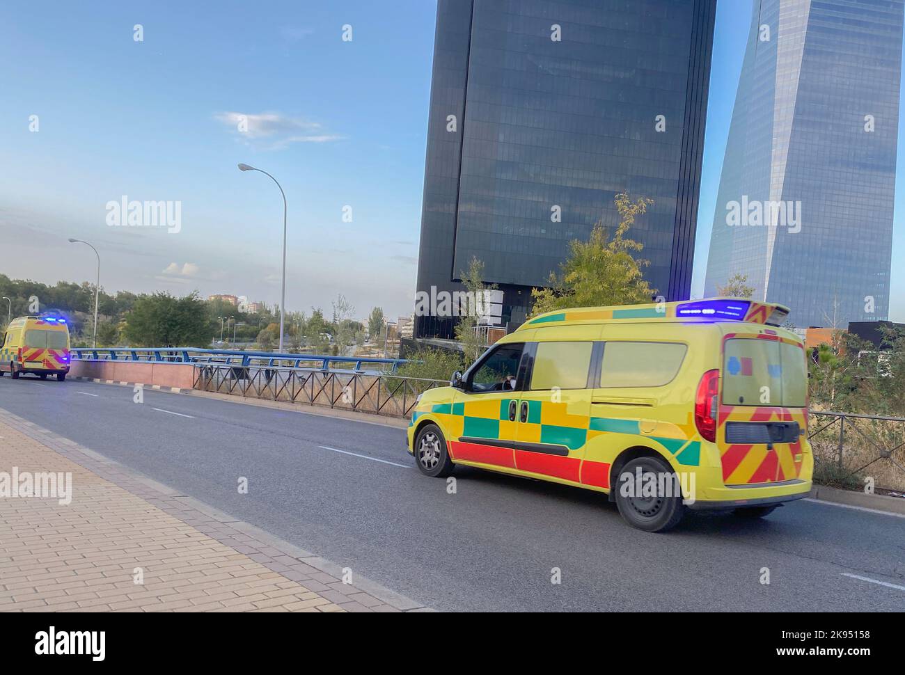 An ambulance on urgency with flashing lights towards the hospital