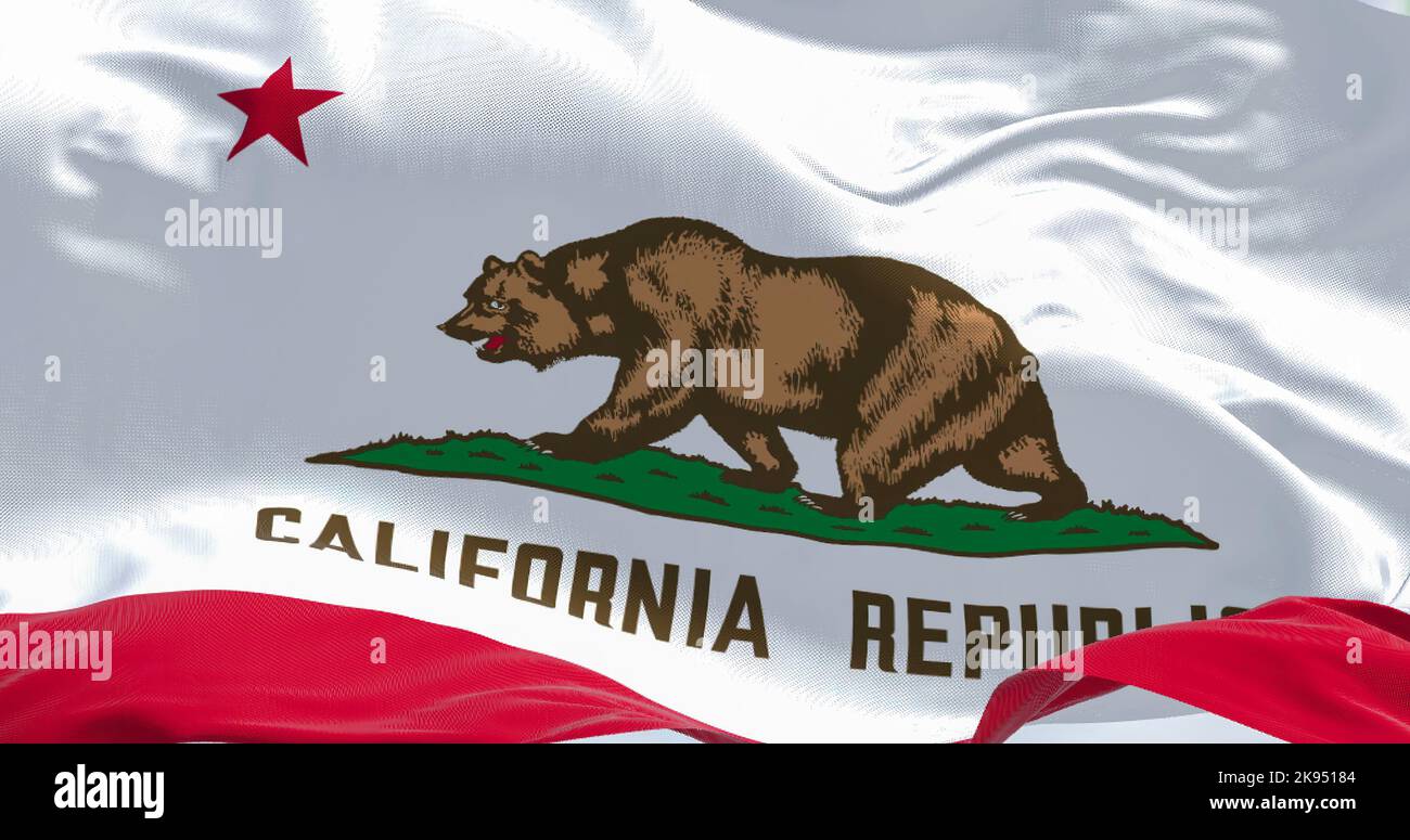 Close-up view of the California State flag waving in the wind. California is a federated state of the US located in the South West Coast. Fabric textu Stock Photo