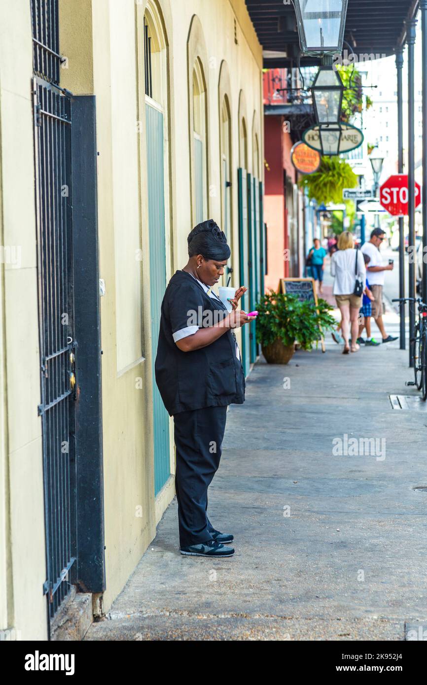 NEW ORLEANS, USA JULY 17 waitres smokes at the sidewalk a cigarette