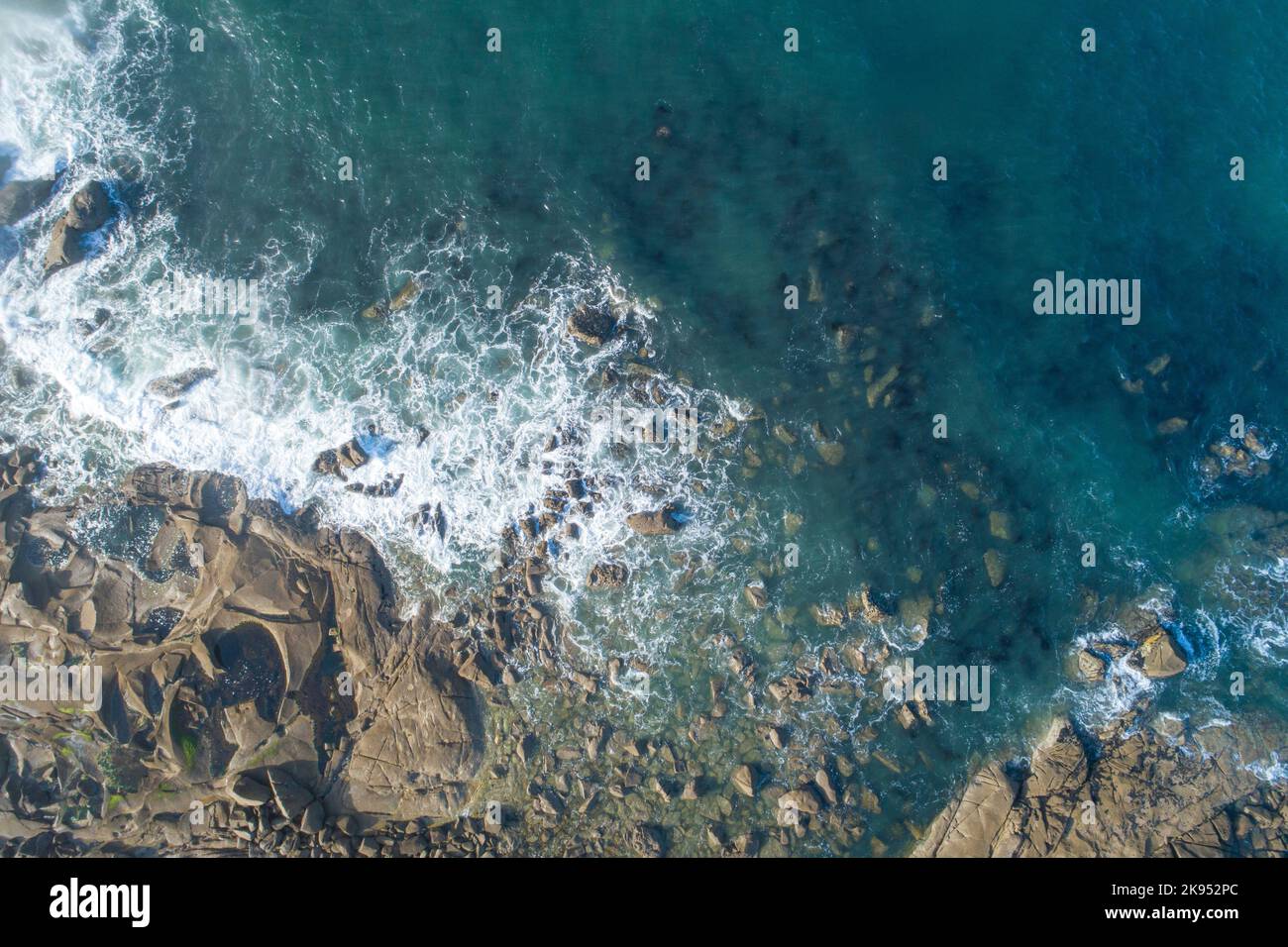 aerial view of waves on a rocky shore of the atlantic ocean Stock Photo ...