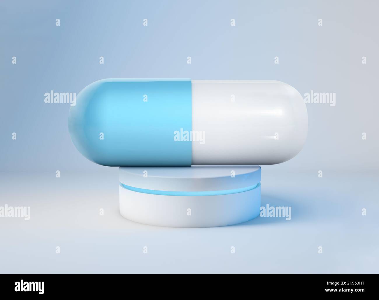 A 3D render of a large blue white medical capsule on an illuminated platform Stock Photo