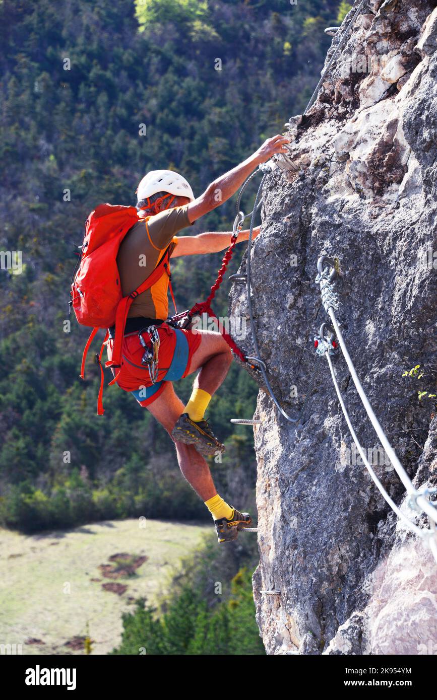 Climber at Orpierre, the new via ferrata built in 2022, France, Hautes Alpes Stock Photo