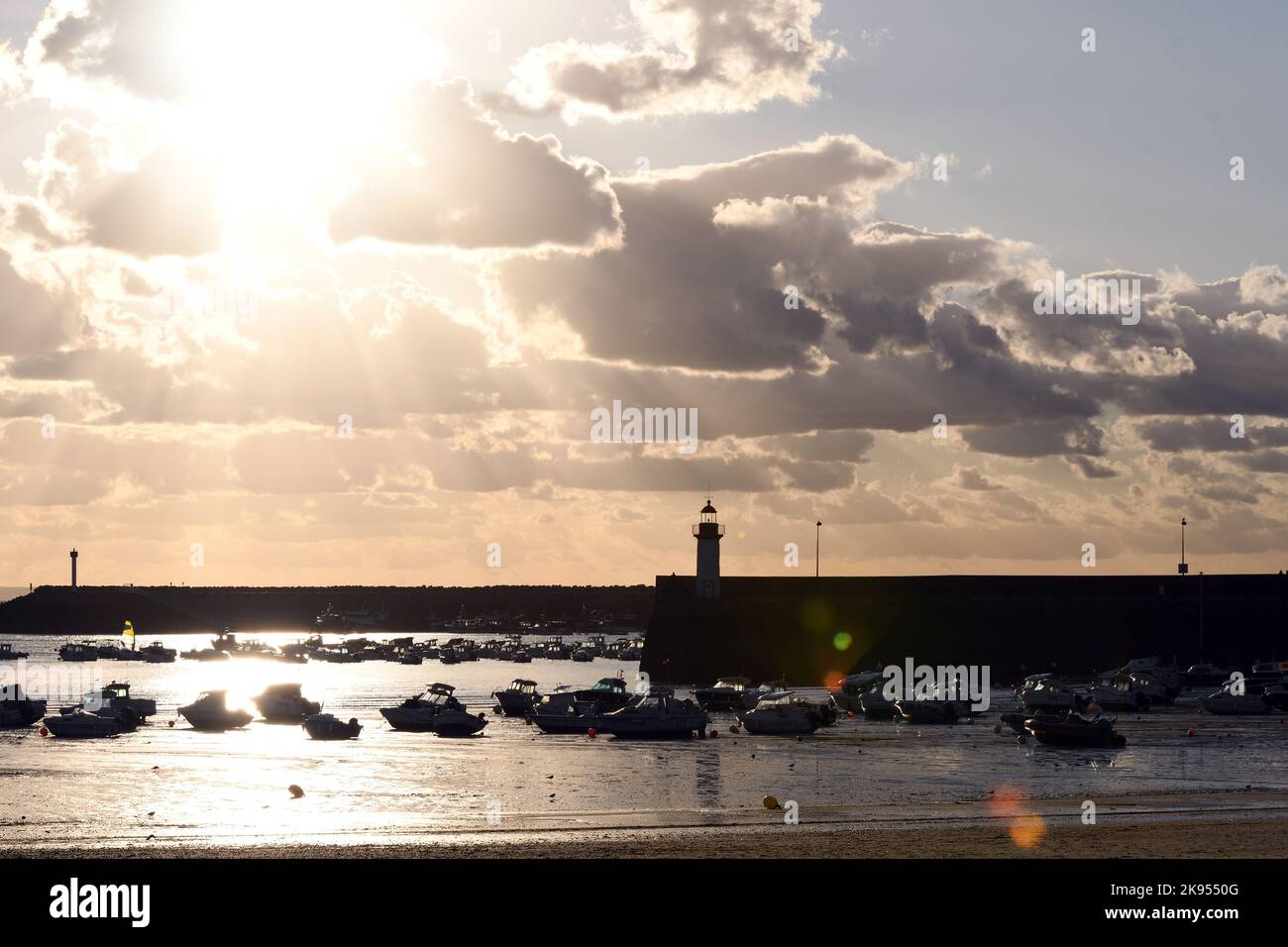 harbour at low tide against the light, France, Brittany, Departement Cotes-d’Armor, Erquy Stock Photo