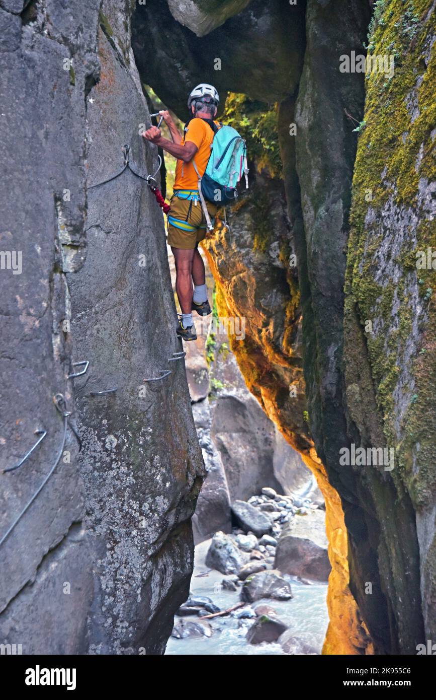 Climber at the Via ferrata at the canyon of Ailefroide, France, Hautes Alpes, Brianconnais Stock Photo