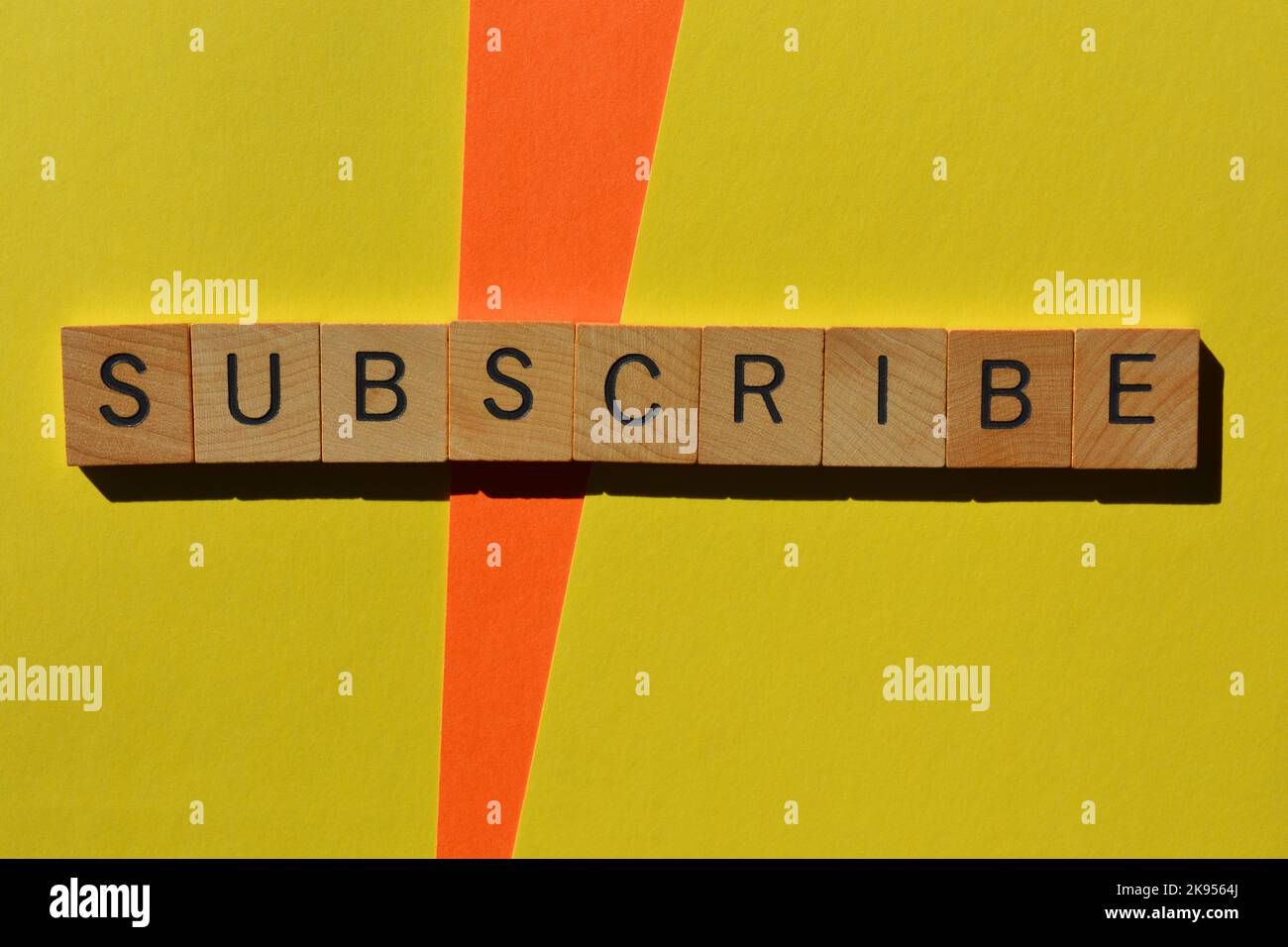 Subscribe, word in wooden alphabet letters isolated on background Stock Photo