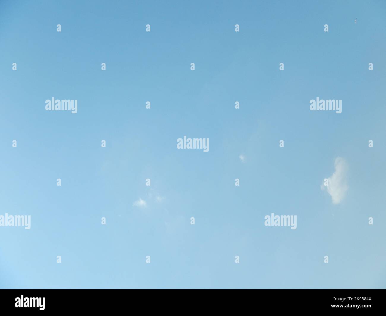 A low angle shot of tiny clouds in a blue sky for wallpapers Stock ...