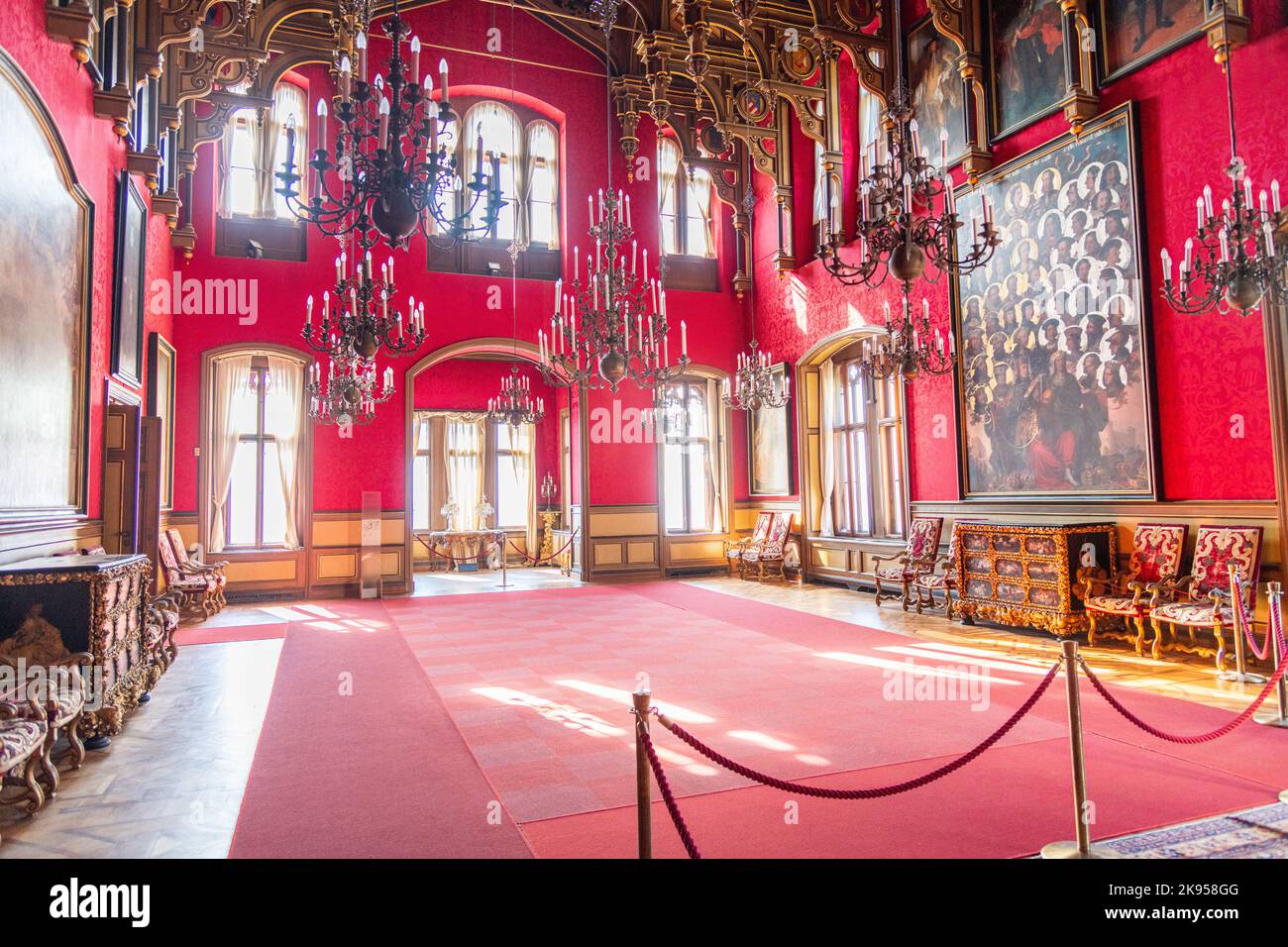 A room with furniture and portraits inside Miramare Castle near Trieste, Italy Stock Photo