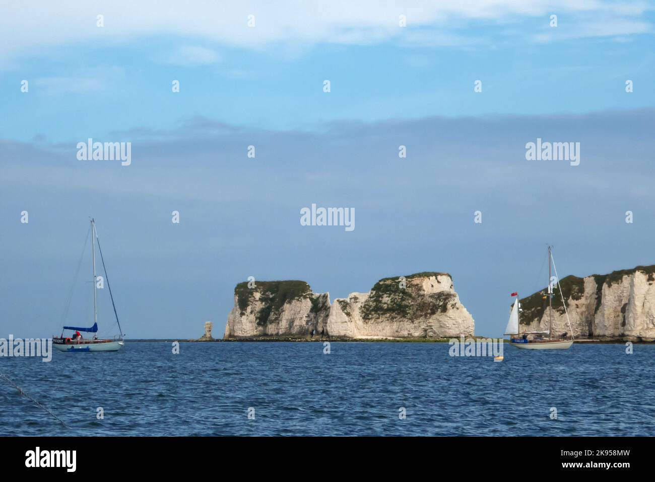 At anchor in Studland Bay, Dorset England,UK, with Great Harry Rocks beyond. Stock Photo