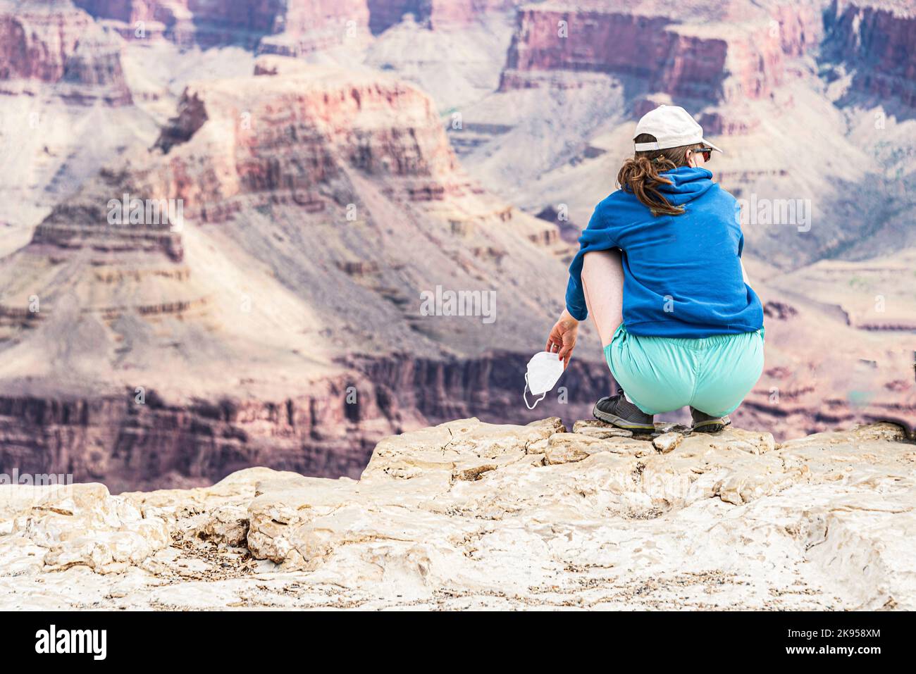 Girl sitting on edge cliff hi-res stock photography and images - Alamy