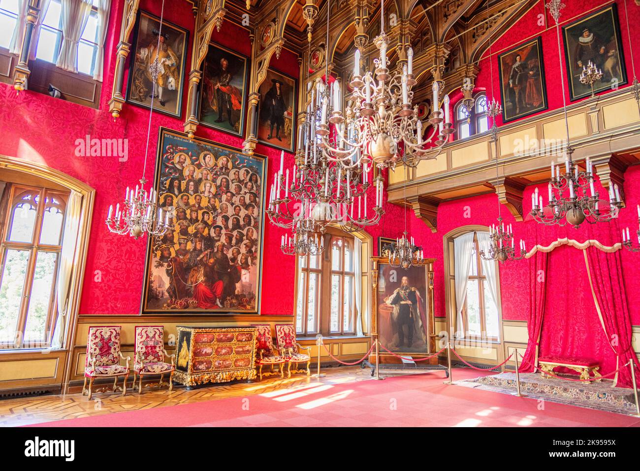 A room with furniture and portraits inside Miramare Castle near Trieste, Italy Stock Photo